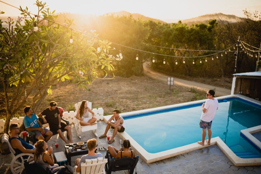 A chill evening with friends and family by a pool in the backyard