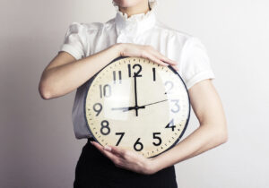 Girl Is Holding A Clock